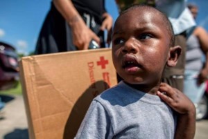 Kadeem, 1, of Iberia Parish, Louisiana visits a Red Cross flood recovery supply distribution center. Photo by: Marko Kokic/American Red Cross 