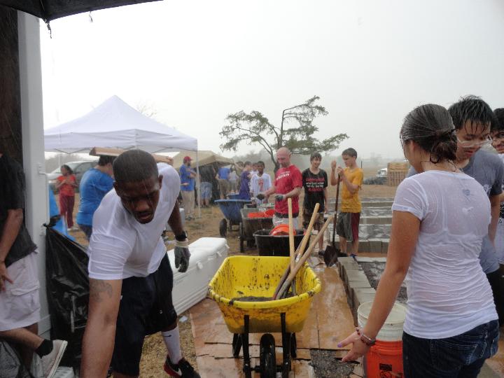 Build-day teamwork in the rain, 2011